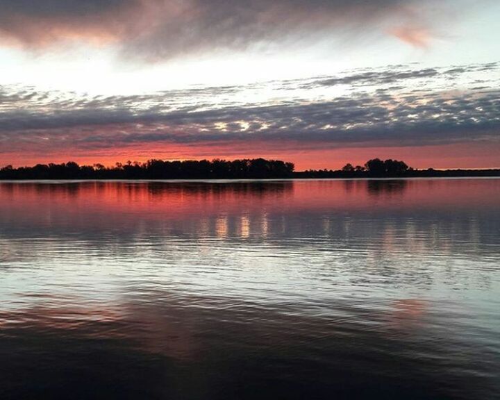 reflection, sunset, sky, beauty in nature, nature, water, tranquility, scenics, outdoors, red, idyllic, no people, tranquil scene, cloud - sky, day