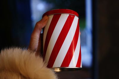 Close-up of hand holding christmas jar