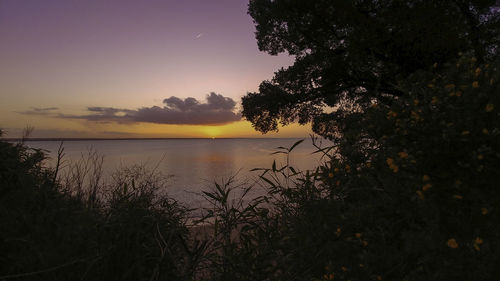 Scenic view of sea against sky at sunset