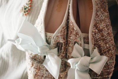 Close-up of clothes hanging on white wall