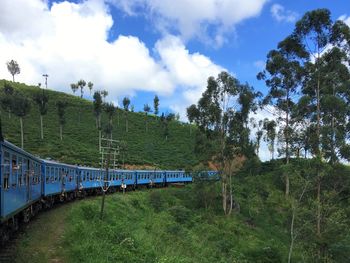 Train on railroad track against sky