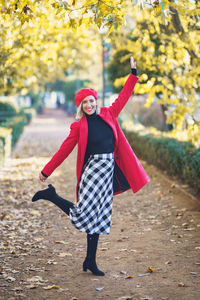 Rear view of woman walking on field