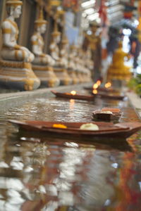 Row of illuminated building at temple