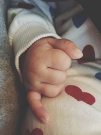 High angle view of baby sleeping on bed at home