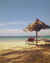 Thatched parasol on idyllic ngapali beach, myanmar 