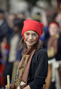 Portrait of smiling young woman standing outdoors