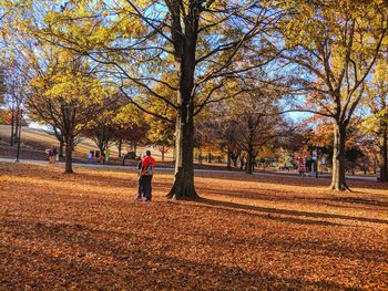 Man walking in park during autumn