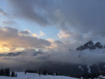 Scenic view of snow covered mountains against sky