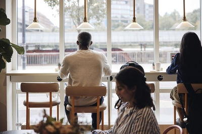 Male and female business professionals working together at coworking office