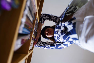 Young woman in the library with books