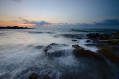 Scenic view of sea against sky during sunset