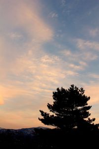 Scenic view of landscape against sky at sunset