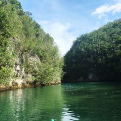 Scenic view of calm lake against sky