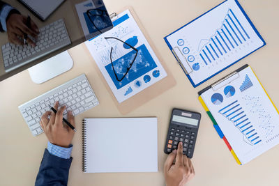 Directly above view of businessman working at desk in office