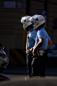 Police officers wearing helmet standing in city