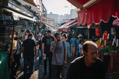 People on street market in city