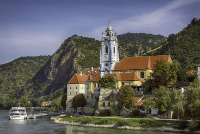 Panoramic view of buildings and mountains against sky