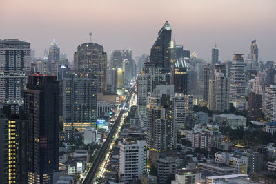 Aerial view of modern buildings in city against sky