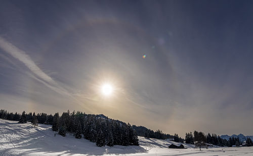 Scenic view of snowcapped landscape against sky during winter