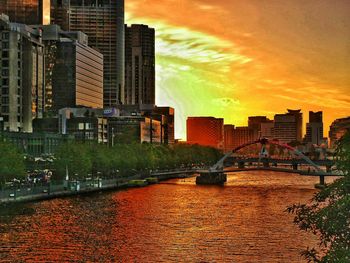 Cityscape against sky at sunset