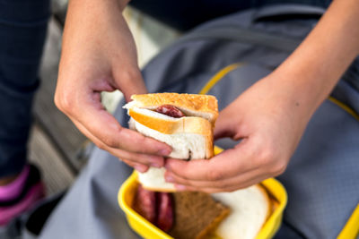 Midsection of man holding food