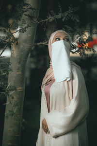 Rear view of woman wearing mask