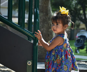 Portrait of cute girl standing outdoors