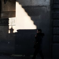 Full length of man standing on wall