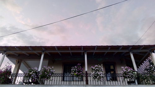 Low angle view of building against cloudy sky