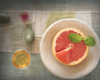 Directly above shot of grapefruit and honey on table