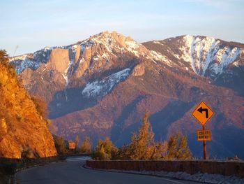 Road amidst mountains against sky