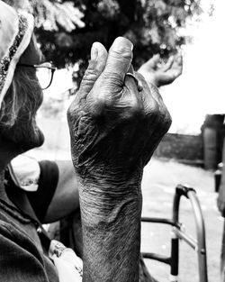 Close-up of man hand on rock