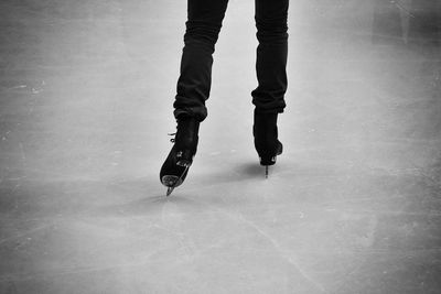 Low section of woman standing on tiled floor