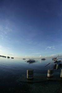 Scenic view of sea against blue sky