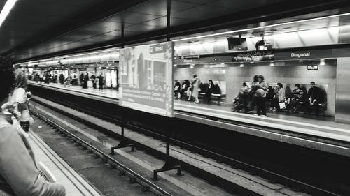 People at railroad station at night