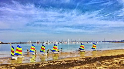 Scenic view of beach against blue sky