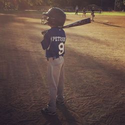 Full length of boy playing on sand