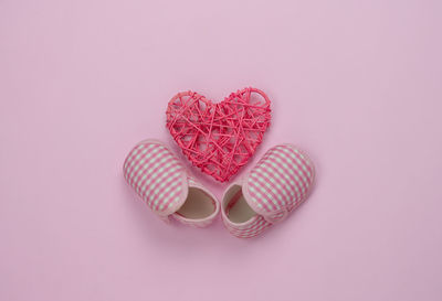 Close-up of heart shape on pink background
