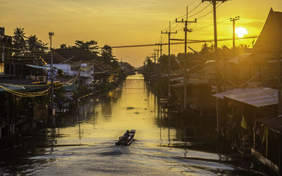 Damnoen saduak floating market in a public corner with canals and boats