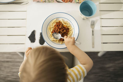 Toddler having pasta meal