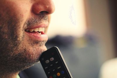 Close-up portrait of man holding camera