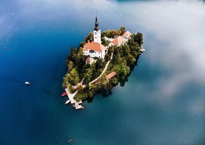 Scenic view of sea and buildings against sky