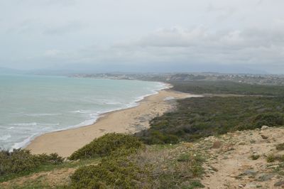 Scenic view of sea against cloudy sky