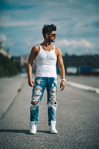 Full length of young man standing on road