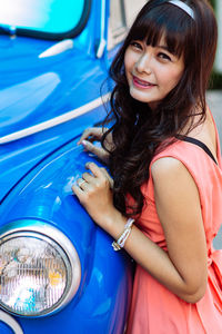 Portrait of young woman in car