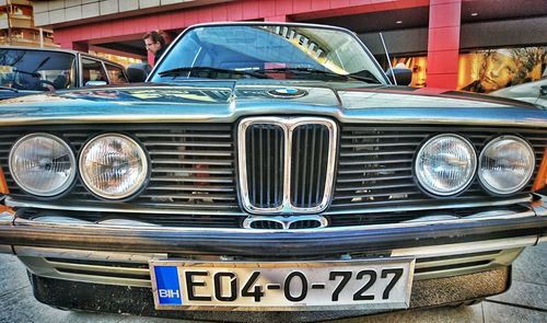 Close-up of vintage car on city