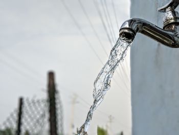 Close-up of water running from faucet