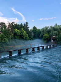 Bridge over river against sky