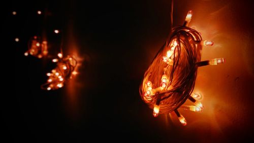 Close-up of illuminated light bulb