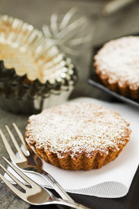 Close-up of dessert forks on table